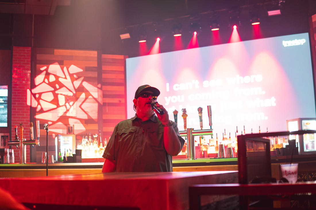 Karaoke singer performing at a Treetop live show