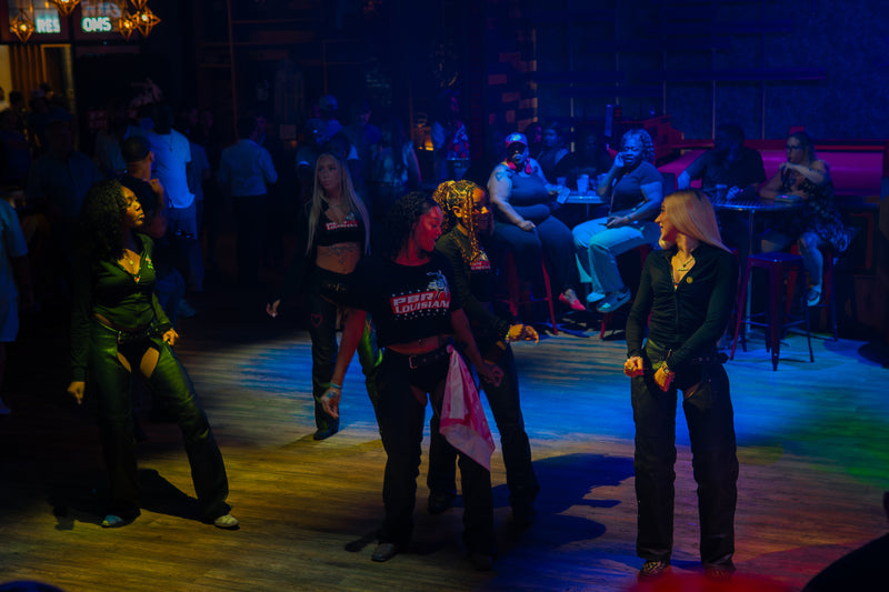 Crowd gathered around the dance floor at a Treetop event